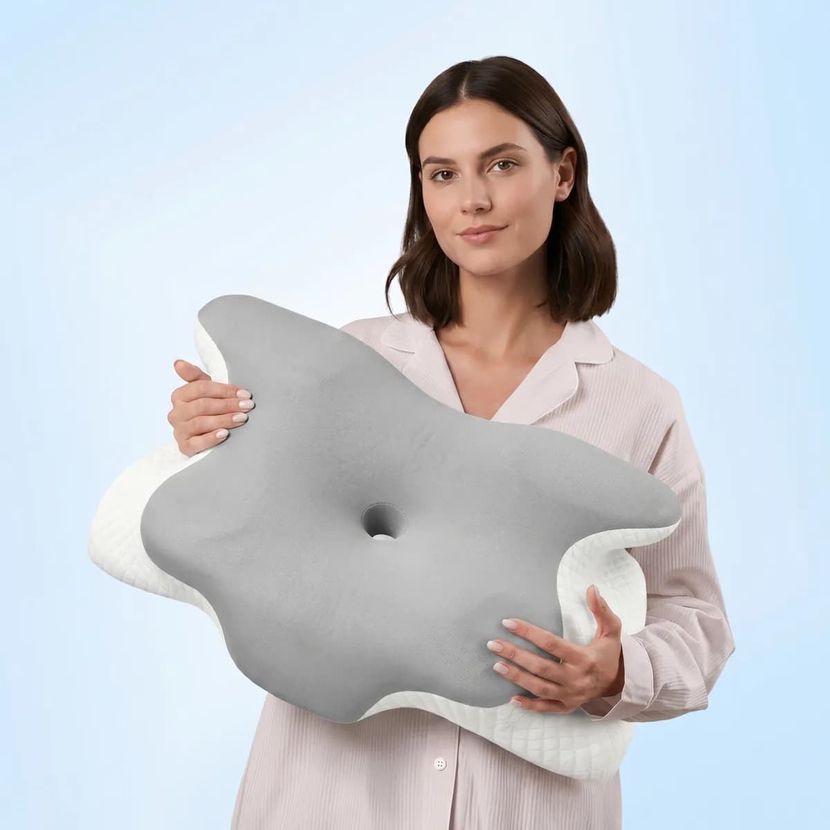 Woman sleeping peacefully on The Sleepr ergonomic butterfly pillow